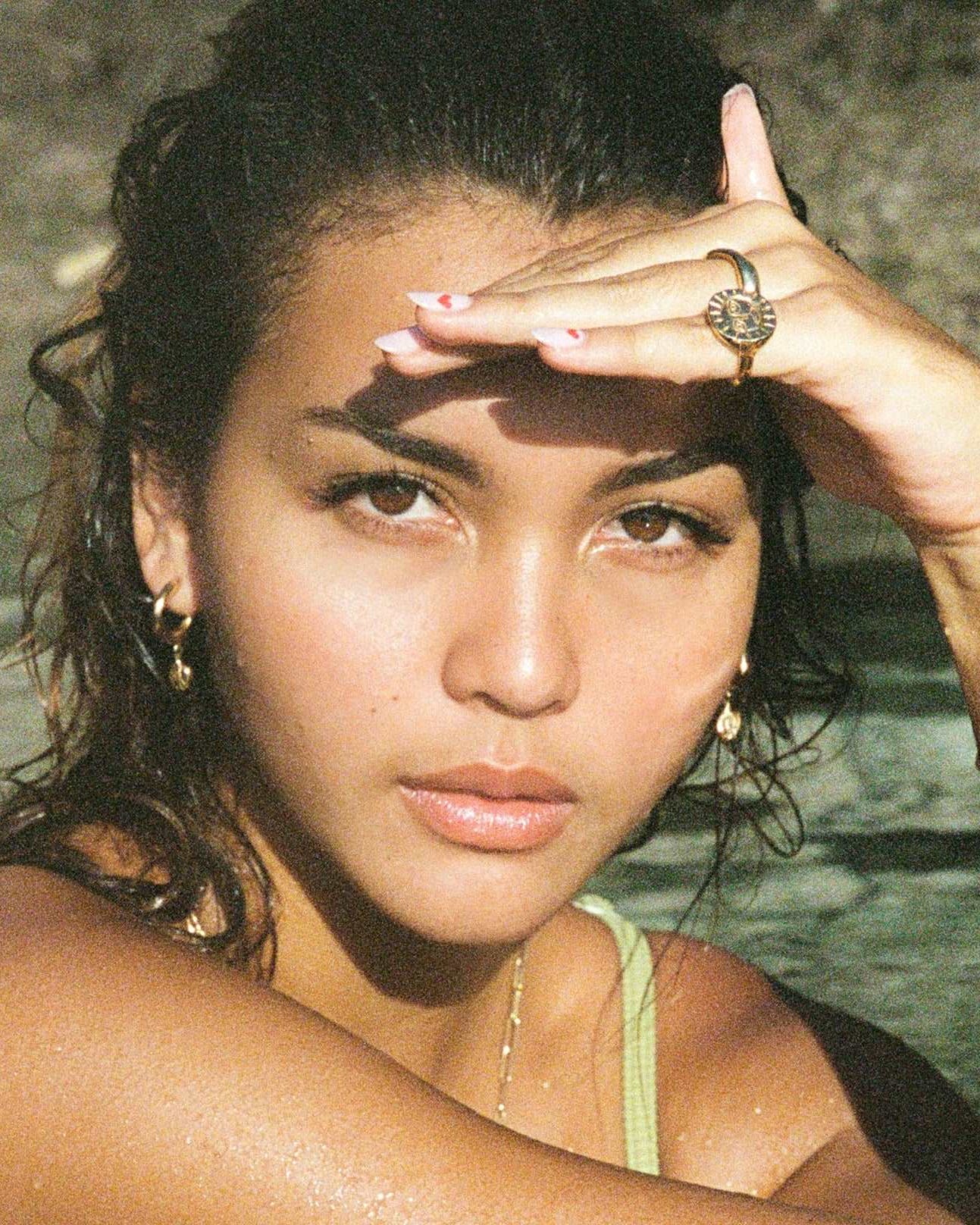 @caitlinnorthlewis wearing the gold sun ring