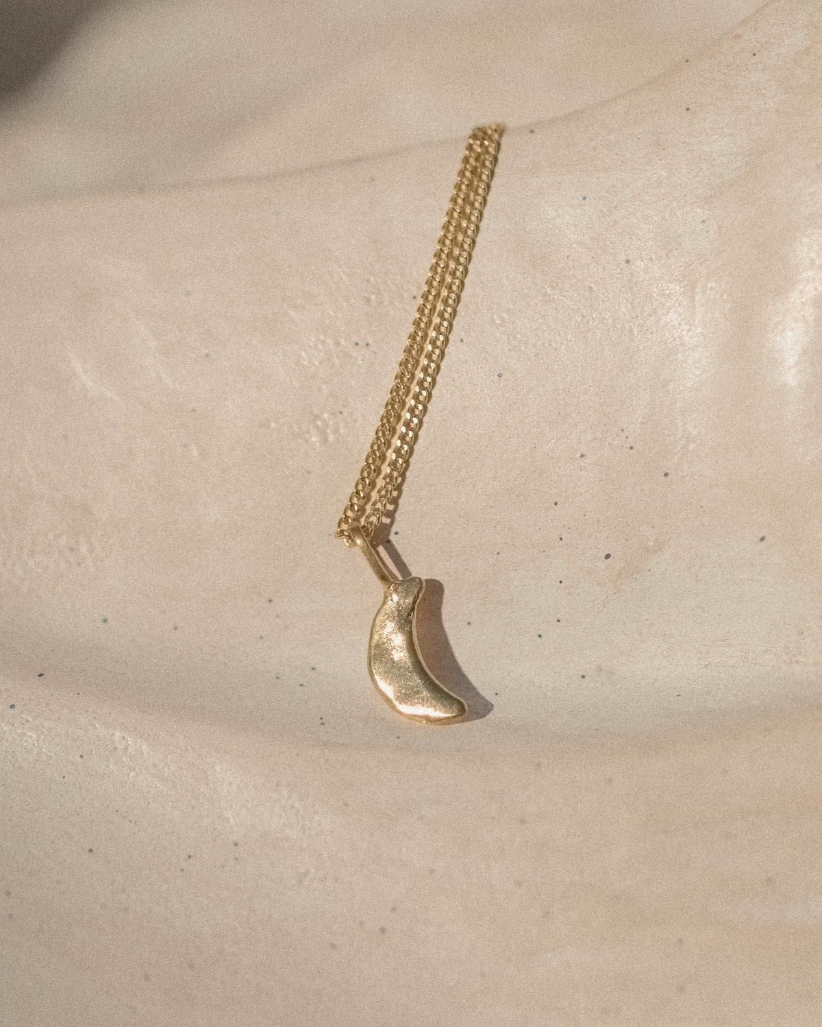 rauw x merge // many moons necklace