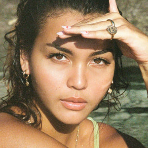 @caitlinnorthlewis wearing the gold sun ring