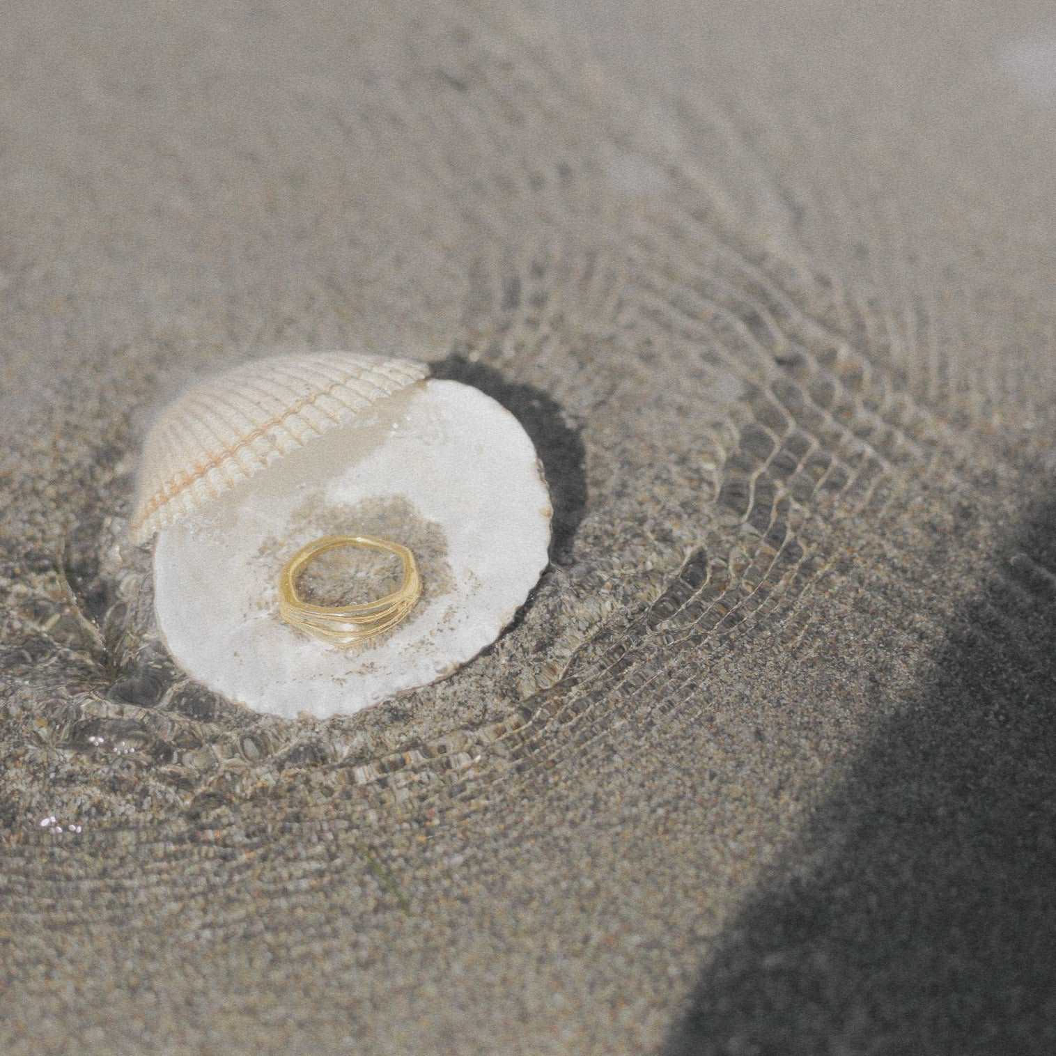recycled gold ring in seashell